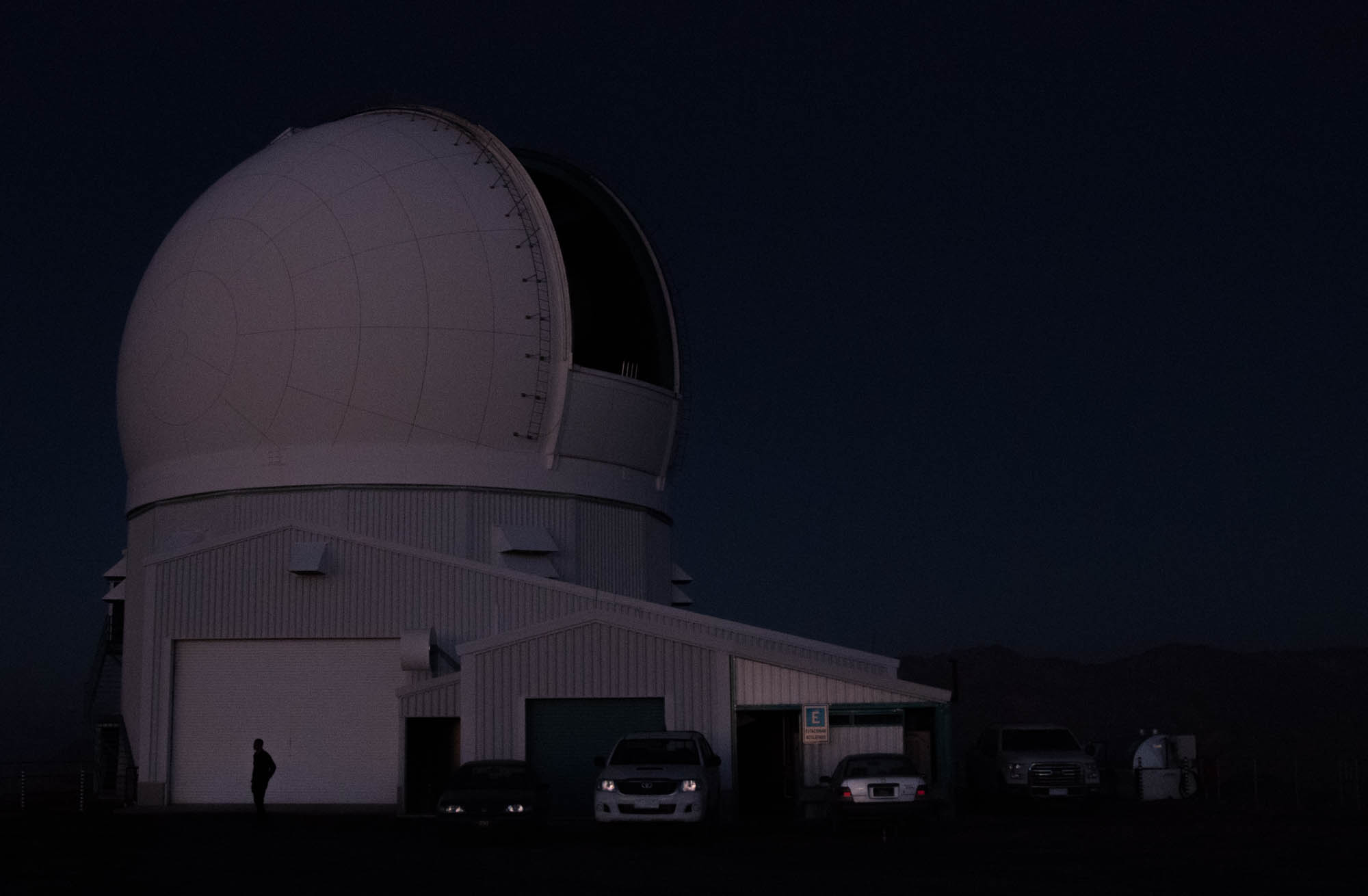 The crew preps for the night after parking all of their cars on the mountain before the sun completely sets. Once it is dark, no light is allowed on the mountain which can make driving without headlights especially treacherous considering the roads leading up to the SOAR telescope are unpaved, with no guard rails and tight turns. “The telescope comes alive at night. This is the most exciting time,” Ugarte says. 