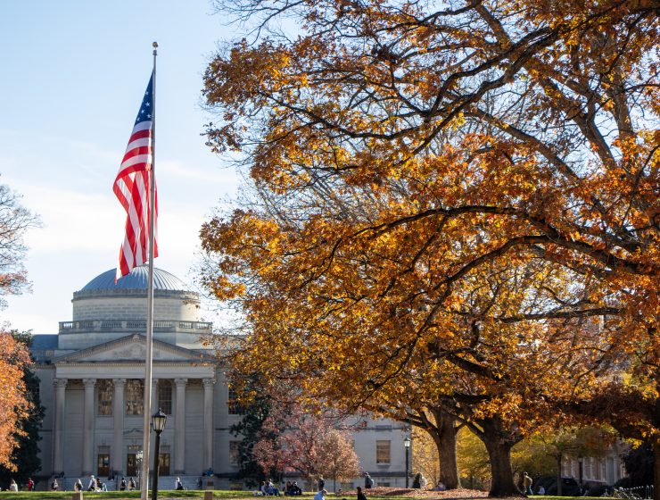 UNC-Chapel Hill campus framed by autumnal-orange trees in November.