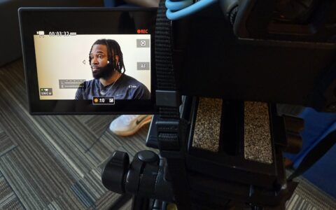 Image of U.S. bobsledder Manteo Mitchell as seen through a video recorder screen, during an interview where he discusses his training plans for the 2026 Winter Olympics.