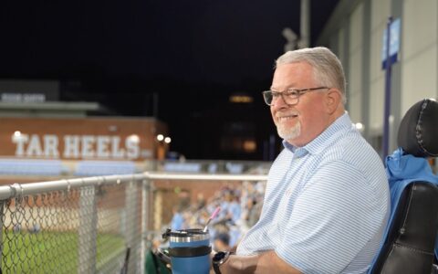 Randall Keen smiles as he watches UNC men's soccer