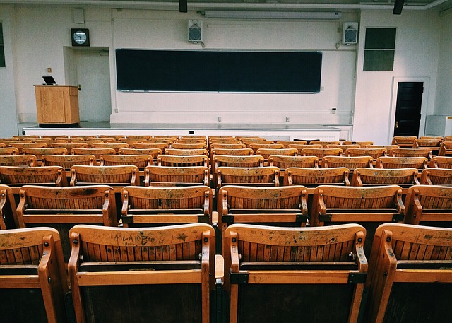 Empty classroom with wooden chairs